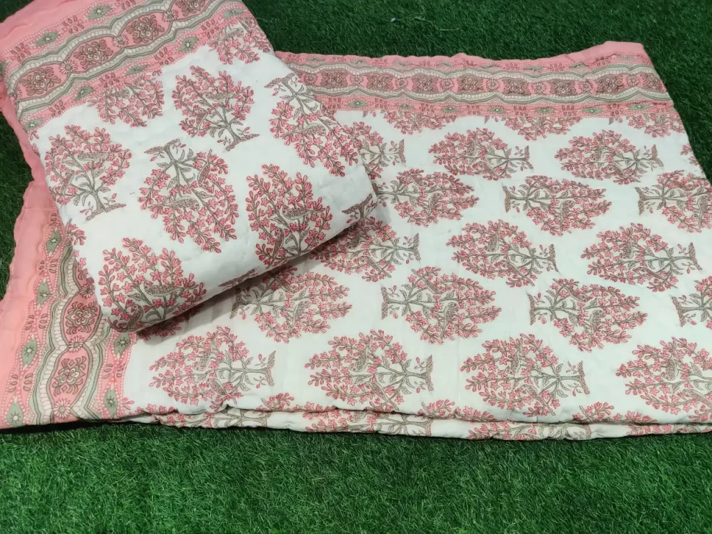 A piece of beauty exquisite pair of single jaipur razai in premium cotton in print of peach on cream