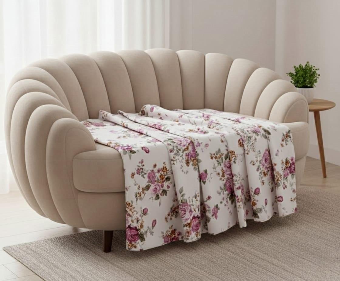 Shades of pastel peachish pink and off white floral print on double bedsheet