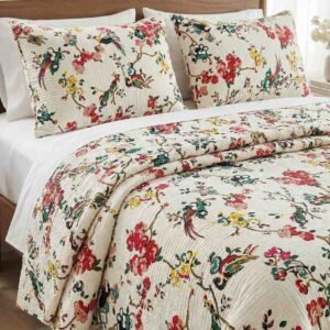 Exquisite bird print in pink on cream quilted, reversible bedcover and two quilted pillow covers