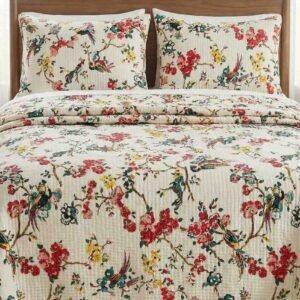 Exquisite bird print in pink on cream quilted, reversible bedcover and two quilted pillow covers