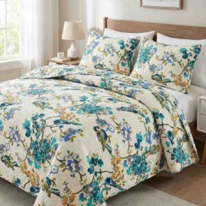 Exquisite bird print in blue on cream quilted, reversible bedcover and two quilted pillow covers