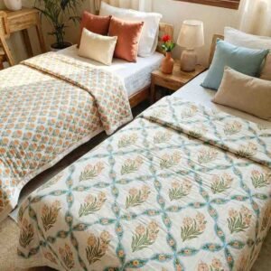 A pair of two single beautiful exquisite jaipur razais in floral booti and jaal design on premium cotton mulmul in orange and turquoise on white