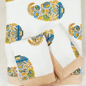 Exquisite paisley print in orange and blue on cream quilted, reversible bedcover and two quilted pillow covers