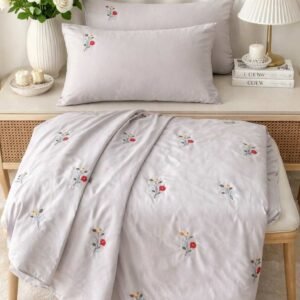 Exquisite embroidered bedsheet in red and yellow floral pattern on light grey premium cotton bedsheet with two pillow covers