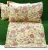 Elegant floral print in shades of yellow and pink on cotton double bedsheet with two pillow covers