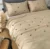 Exquisite embroidered bedsheet in yellow and black honey bee pattern on beige premium cotton bedsheet with two pillow covers