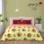 Floral print in maroon on yellow double  bedsheet and two pillow covers in premium quality pure cotton