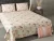 Shades of pastel peach and pink allover floral print on  double  bedsheet