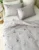 Exquisite embroidered bedsheet in red and yellow floral pattern on light grey premium cotton bedsheet with two pillow covers