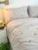 Exquisite embroidered bedsheet in yellow floral pattern on light grey premium cotton bedsheet with two pillow covers