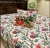 Exquisite floral  print in red on cream quilted, reversible bedcover and two quilted pillow covers