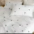 Exquisite embroidered bedsheet with blue floral pattern on white in premium cotton bedsheet along with two pillow covers