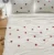 Exquisite embroidered bedsheet with red ladybug pattern on white in premium cotton bedsheet along with two pillow covers
