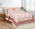 shades of peach, pink and brown on cream double bedsheet and two pillow covers