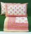 Elegant print in shades of pink, yellow and orange on white cotton double bedsheet with two pillow covers